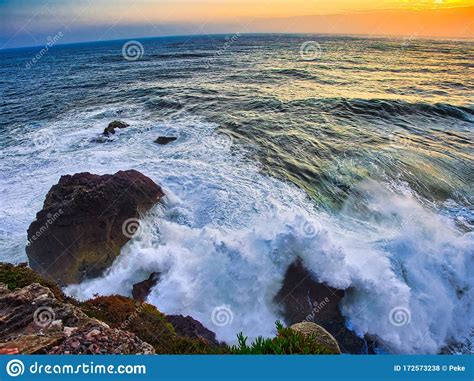 Sunset at Nazare waves stock photo. Image of sunset - 172573238