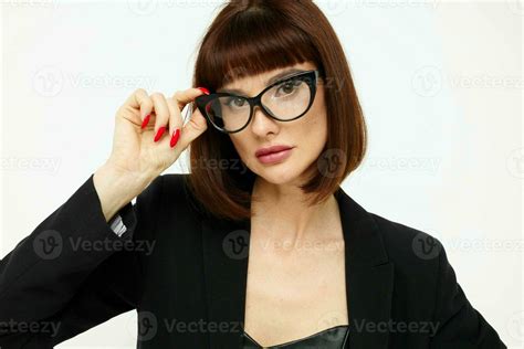 beautiful woman in a black jacket red nail polish glasses Lifestyle unaltered 25028227 Stock ...