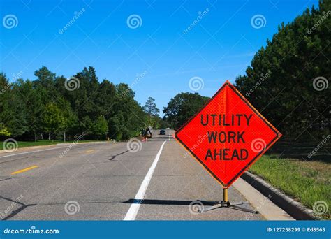 Utility Work Ahead Sign with Service Vehicle on Street Stock Image ...