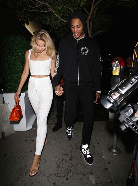 Jasmine Sanders and Kelly Oubre Jr. hold hands as they leave “Bootsy ...