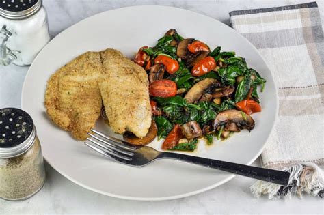 Baked Haddock with Spinach , Tomatoes and Mushrooms Stock Photo - Image of seafood, lunch: 313252224