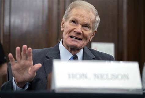 AP Interview: NASA chief big on climate, hedges on moon date