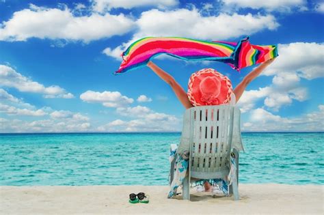 Premium Photo | Woman sitting on the beach chair