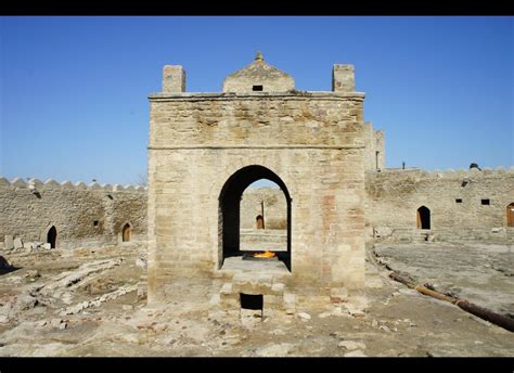 an old stone building with a door in the middle