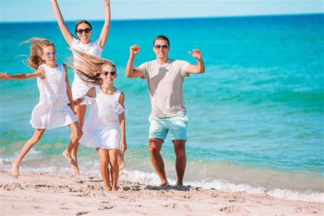 Young Family on Vacation Have a Lot of Fun Stock Image - Image of ocean, seaside: 192123145