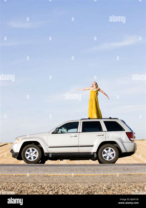 Woman Standing On Roof Car Stock Photos & Woman Standing On Roof Car Stock Images - Alamy