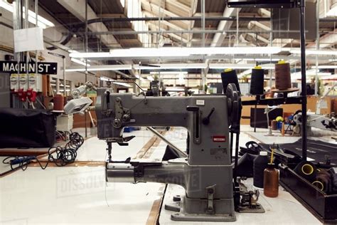 Sewing machine in clothing factory - Stock Photo - Dissolve