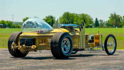 This coffin has been transformed into a four-wheeled V8 Dragula replica ...