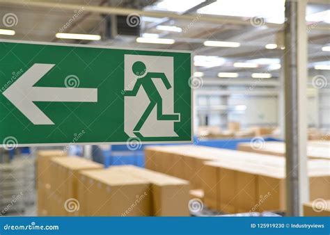 Emergency Exit Sign in the Warehouse of an Industrial Company Stock ...