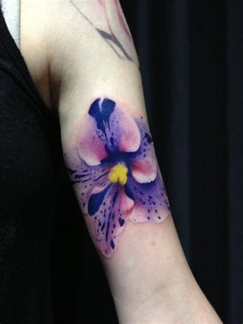 Very realistic detailed and colored flower tattoo on arm - Tattooimages.biz