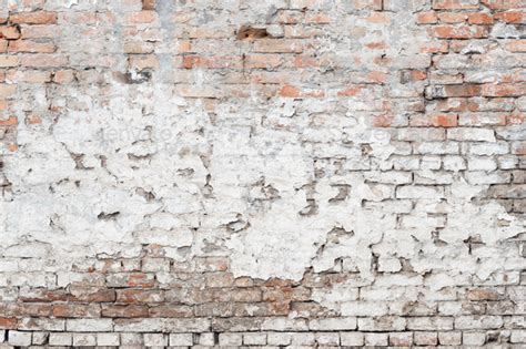 Texture of damaged old brick wall with weather worn surface as background Stock Photo by ...