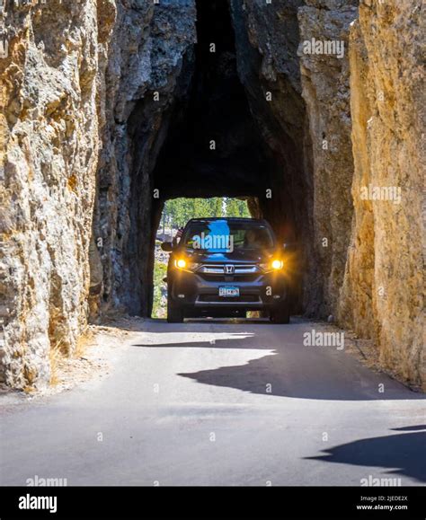 Car in Needles Eye Tunnel on the Needles Highway in Custer State Park ...