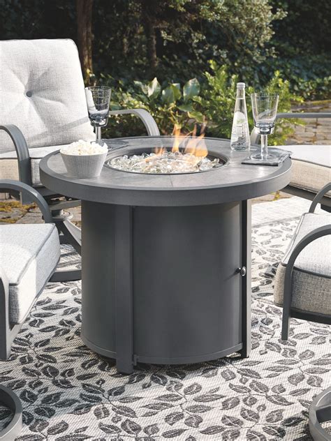 Donnalee Bay - Dark Gray - Round Fire Pit Table - EZ Furniture Sales ...