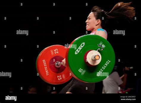 Kuo Hsing-Chun of Taiwan competes in the women's 59kg weightlifting event, at the 2020 Summer ...