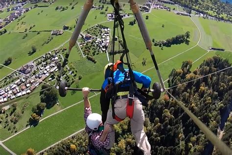 Hang glider's terror flight as he's forced to cling on for dear life ...