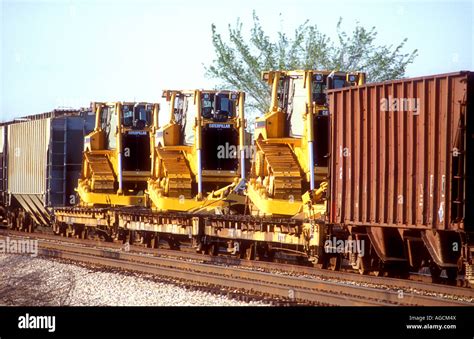 Freight train carrying Caterpillar bulldozers from the factory in ...