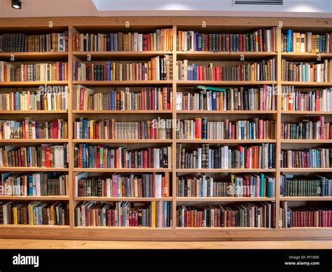 Image of wooden book shelf with books in library Stock Photo - Alamy