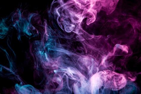 Swirling blue and purple smoke of vape | Premium Photo