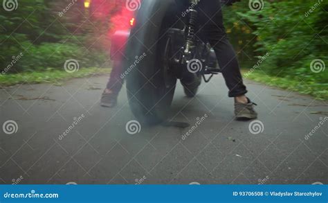 Man Doing a Tire Burnout on Motorcycle on the Forest Road Stock Footage - Video of forest ...