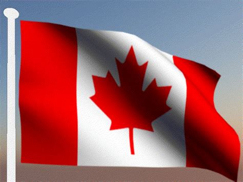 the canadian flag is waving in the wind