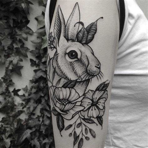 Rabbit and flowers tattoo by Roald Vd Broek - Tattoogrid.net