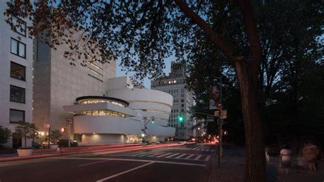 A view of the Solomon R. Guggenheim Museum in New York City at late dusk.