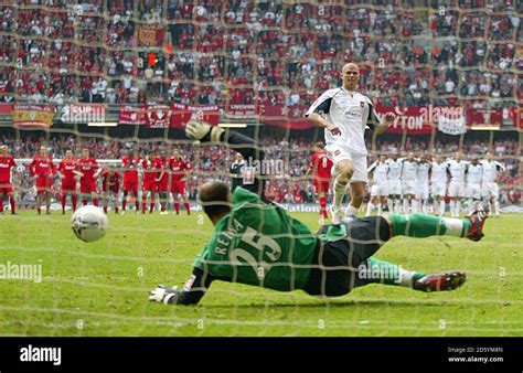 Liverpool goalkeeper Jose Reina saves a penalty from West Ham United's ...