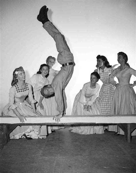 Russ Tamblyn showing off his acrobatic skills on the set of Seven Brides for Seven Brothers ...