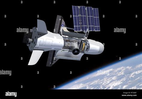 Artist's concept of the NASA X-37B spacecraft in orbit, showing payload ...