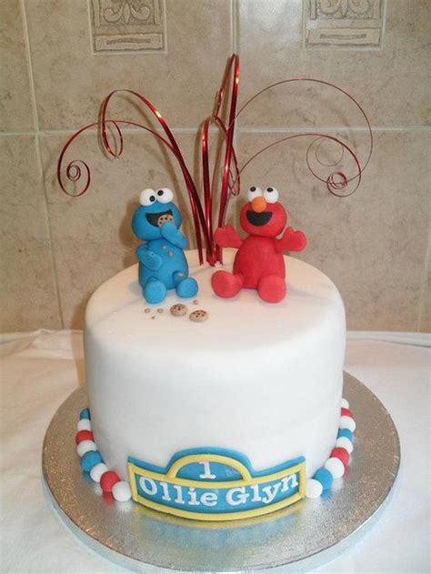 Elmo and the Cookie Monster - Decorated Cake by Marie 2 U - CakesDecor