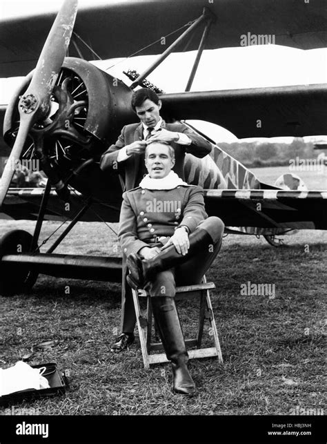 THE BLUE MAX, George Peppard, getting a trim from hair designer Jay ...