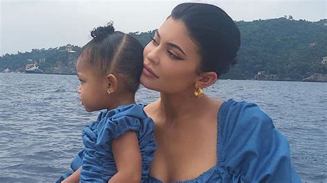 Kylie-jenner-posing-with-daughter-stormi-in-blue-leather-outfit