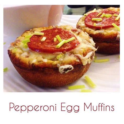 there are two muffins with toppings on the top and one has pepperoni