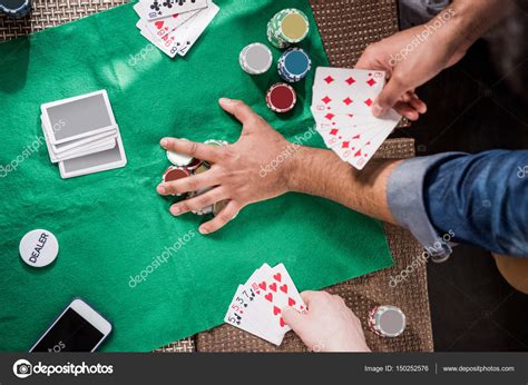 Men at gaming table — Stock Photo © ArturVerkhovetskiy #150252576