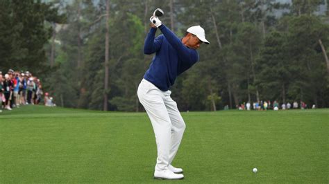 Nike athlete Tiger Woods continues to wear another company's golf shoes ...