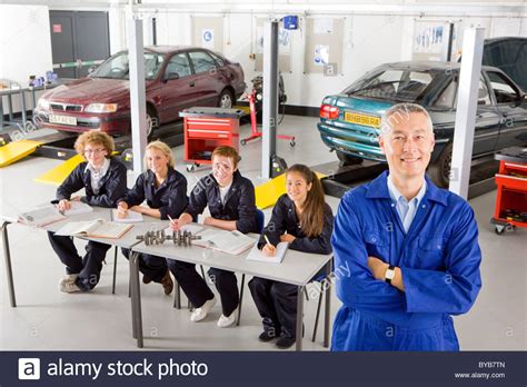 Teacher with students studying automotive trade in vocational school Stock Photo, Royalty Free ...