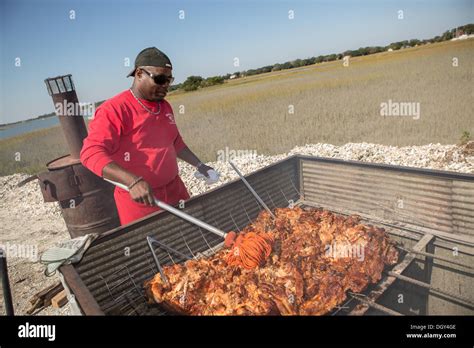 BBQ Pit Master Rodney Scott during Cook it Raw outdoor BBQ event on ...