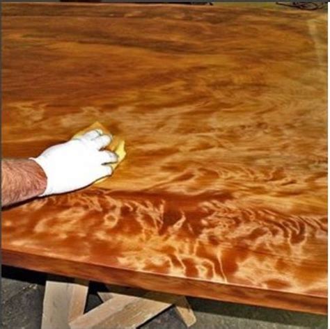 Applying an oil finish to a very cool Ancient Kauri active grained tabletop. | Hardwood design ...