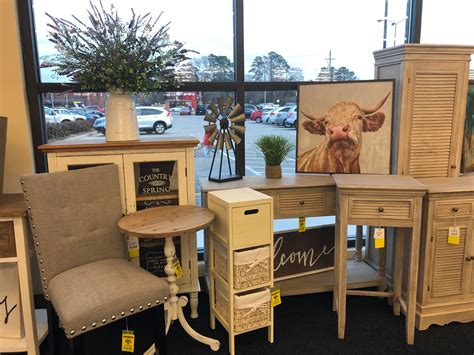 an assortment of furniture is displayed in front of a window