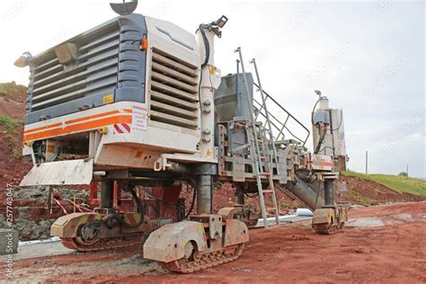 Concrete Paving machine on a road construction site Stock Photo | Adobe Stock