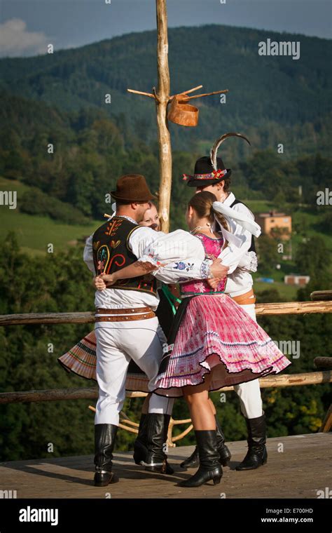 Czech folklore dancers, wearing traditional costume, performing traditional dance on stage in ...