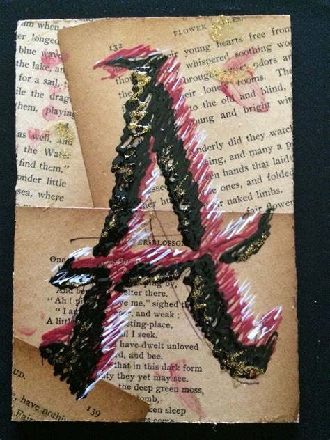 an altered photograph of the letter a on top of a piece of old book paper