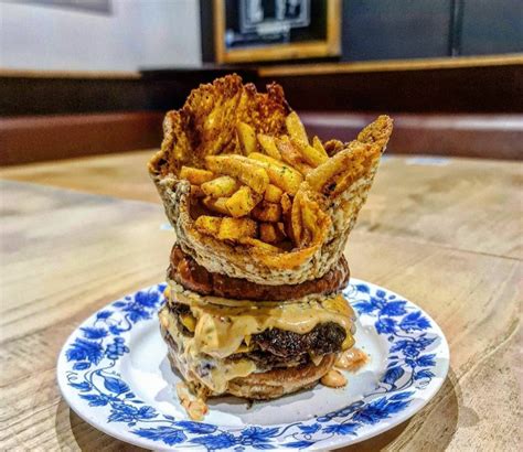 Burger with crispy cheese crown full of fries : r/StupidFood