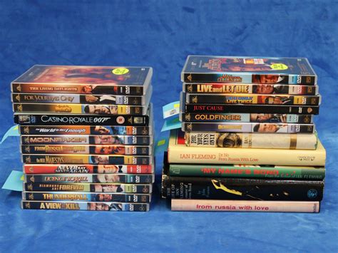 Lot - LOT OF JAMES BOND HARD COVER BOOKS AND DVDS