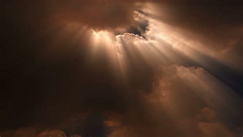 Sunbeams Stream From Roiling Clouds In The Sky. Stock Footage Video 1358860 | Shutterstock