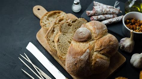 Premium Photo | Different types of bread on a dark background