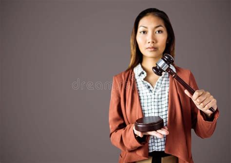 Female Judge With Gavel Against Brown Background Stock Image - Image of ...