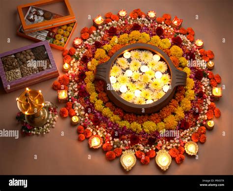 A STILL LIFE OF DIWALI FESTIVAL DECORATION IN MUMBAI INDIA SHOWING RANGOLI, DIYAS, SWEETS ...