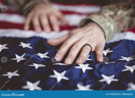 American Soldier Mourning and Praying with the American Flag in Front ...