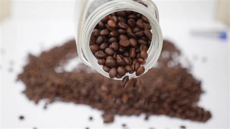 Pouring Coffee Beans On White Background Stock Footage SBV-338773871 - Storyblocks